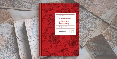 Red book laid on maps.